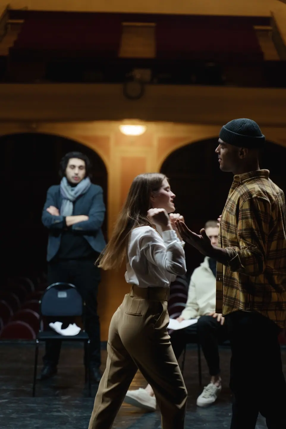 two actor stage an argument scene during a rehearsal